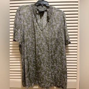 Olive green blouse with blue and white design.